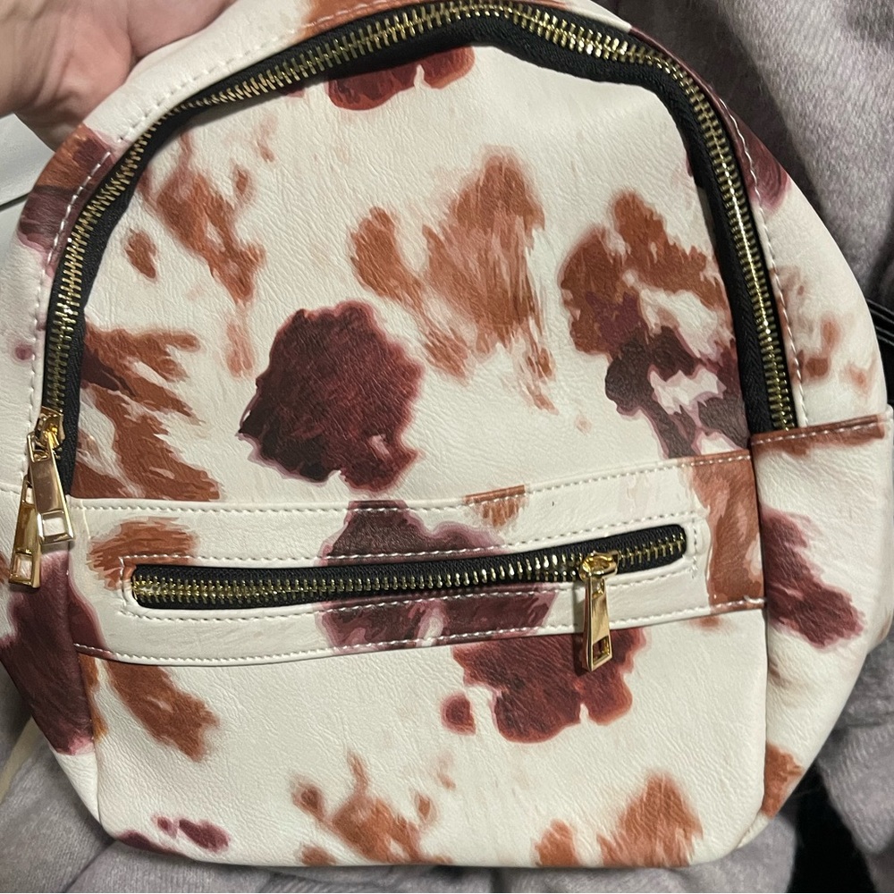 Small cow print backpack purse. Brand new never been carried